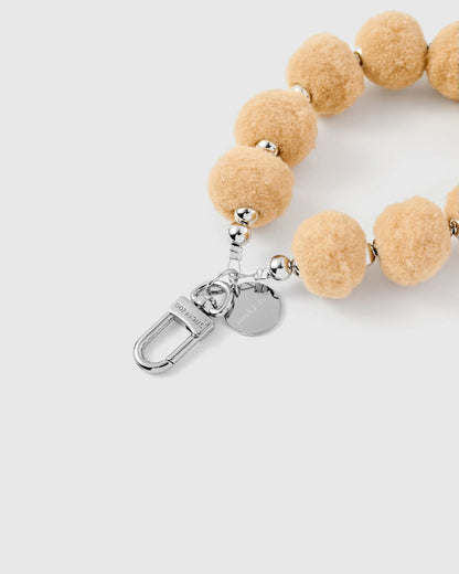 BEIGE POM PHONE STRAP